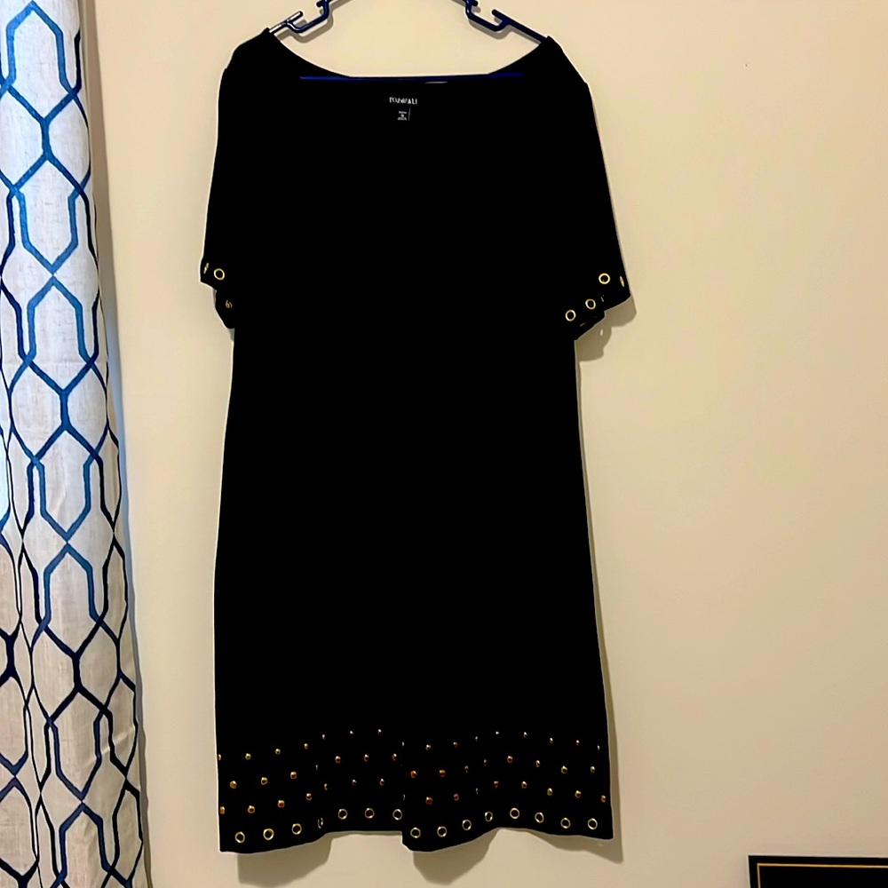 Cute black and a-line dress with gold ring accents.